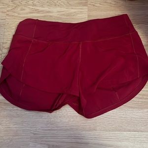Red lululemon speed up with 2.5 inseam.